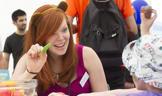 Female working as a volunteer with children