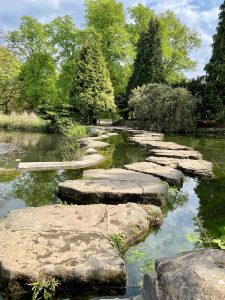 Stone stepping stones across a small lake
