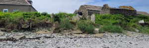 Image showing several stone-sided ‘nousts’ (narrow channels to draw boats into above the high tide line) at Mayback, Papa Westray, demonstrating that places where vessels were pulled up were not necessarily solitary, as indicated by the saga.